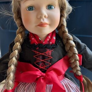 Schneider porcelain German outfit doll with stand